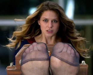 supergirl_gets_her_stocking_feet_tickled_in_stocks_by_yoyomah1_de9lvw9-fullview.jpg